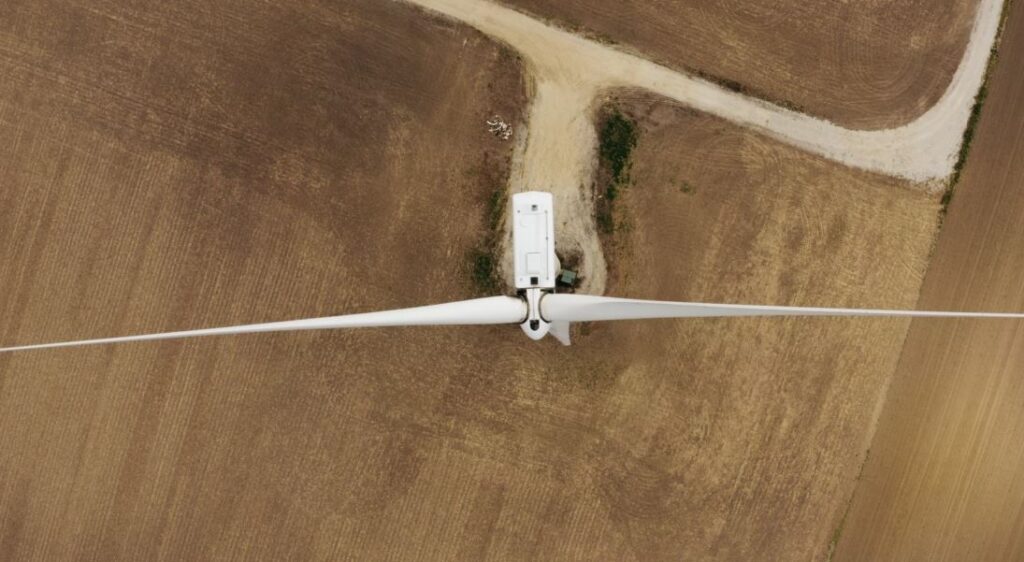 Drone flying over a dry field, captured from above