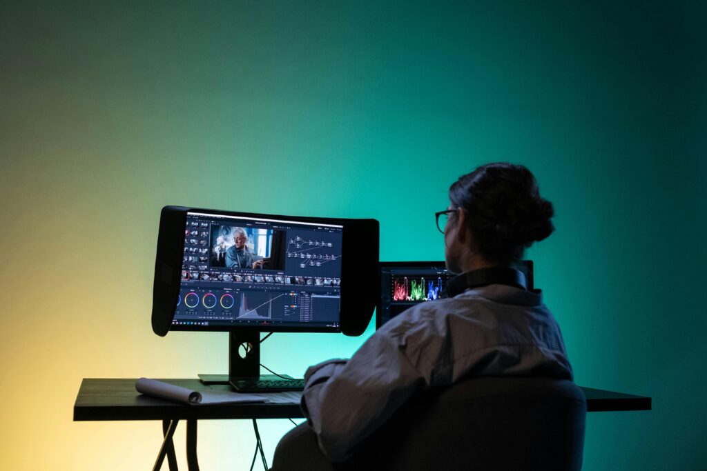 ideo editing professional working on a desktop with color grading software