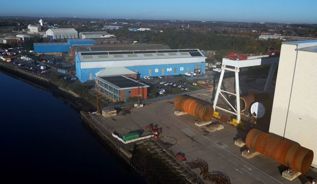 Aerial photo of an industrial site with large buildings and machinery